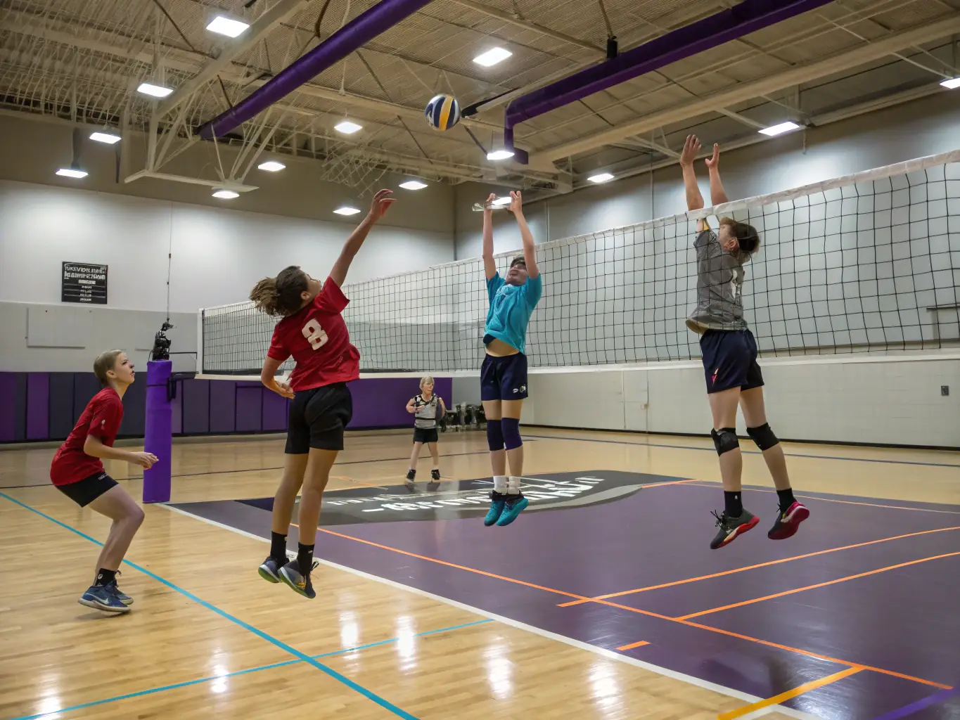 An action shot of students competing in a volleyball match during an inter-faculty tournament, highlighting the competitive spirit and camaraderie fostered by BSS events.