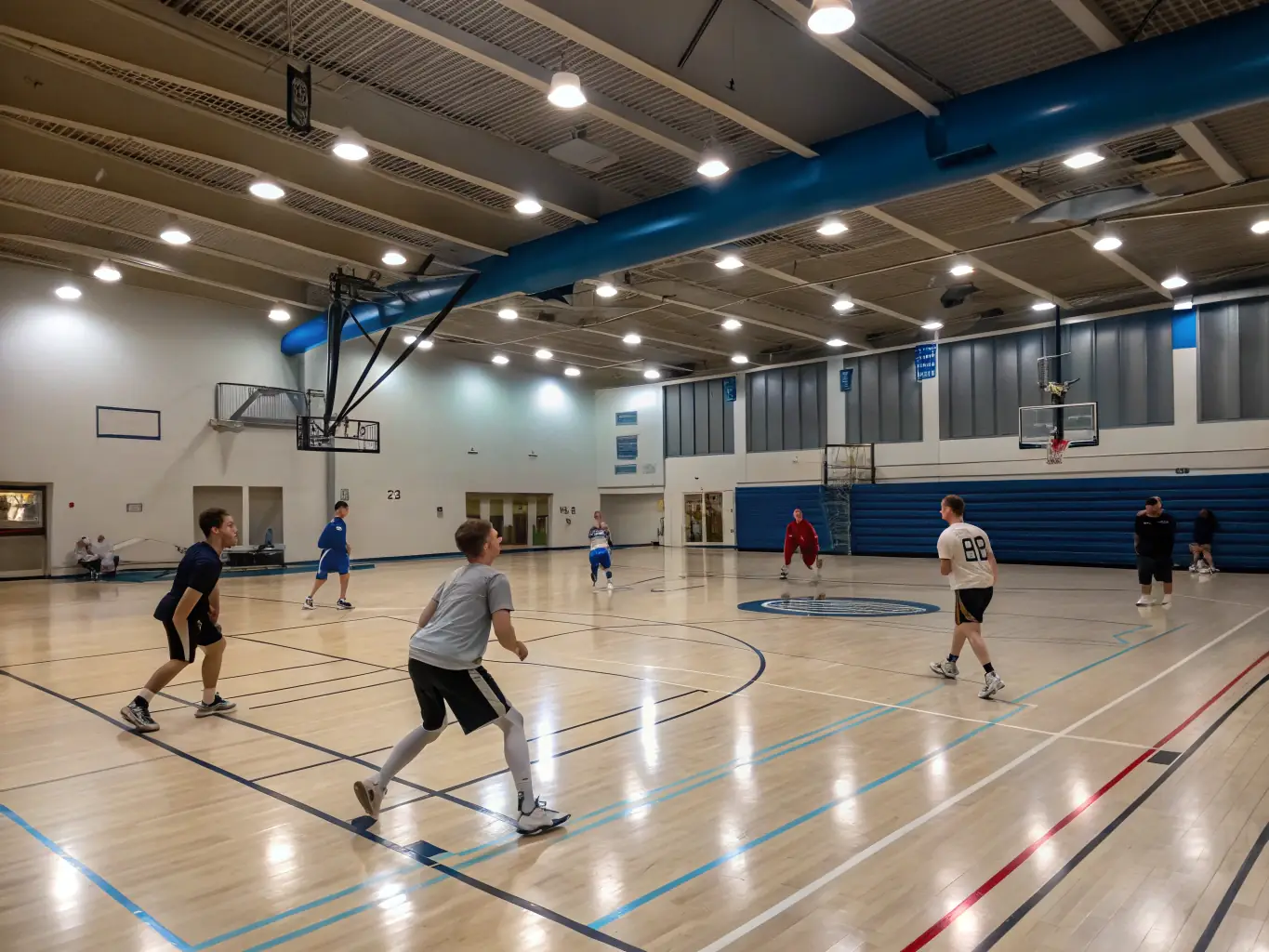 A vibrant image depicting students playing basketball in an indoor court, showcasing the energy and teamwork involved in the weekly indoor sports activities organized by BSS.